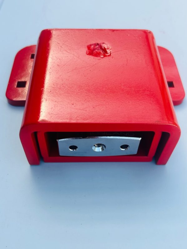 SCL lock body from the side, showing the two-part hardened steel construction and bolt-hole base plate